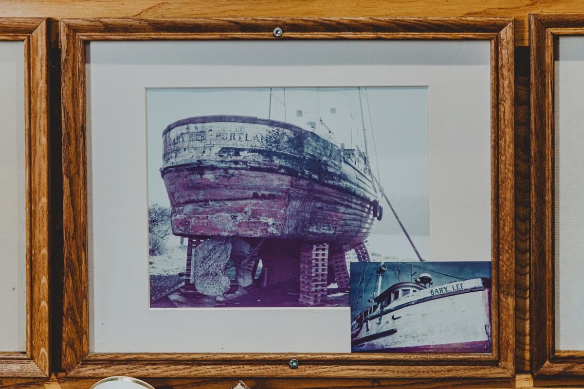 Framed historic photo of the Newport fishing boat Gary Lee of Portland hanging on the wall at the Barge Inn Tavern