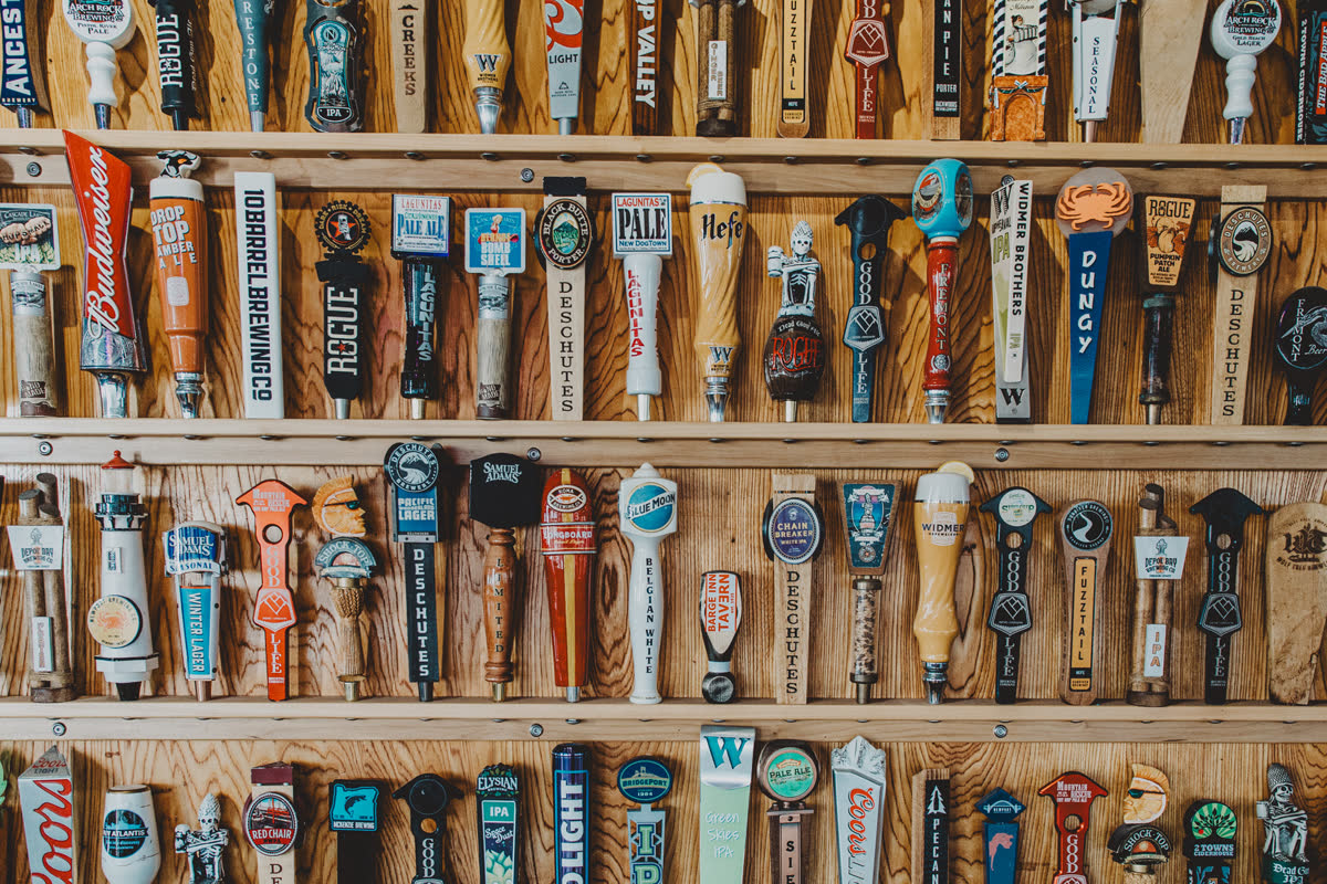 Wall of Oregon craft beer tap handles behind the bar at the Barge Inn Tavern in Newport